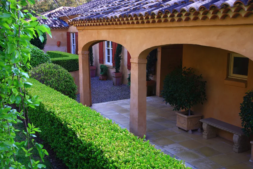 Paved patio framed by layered planting