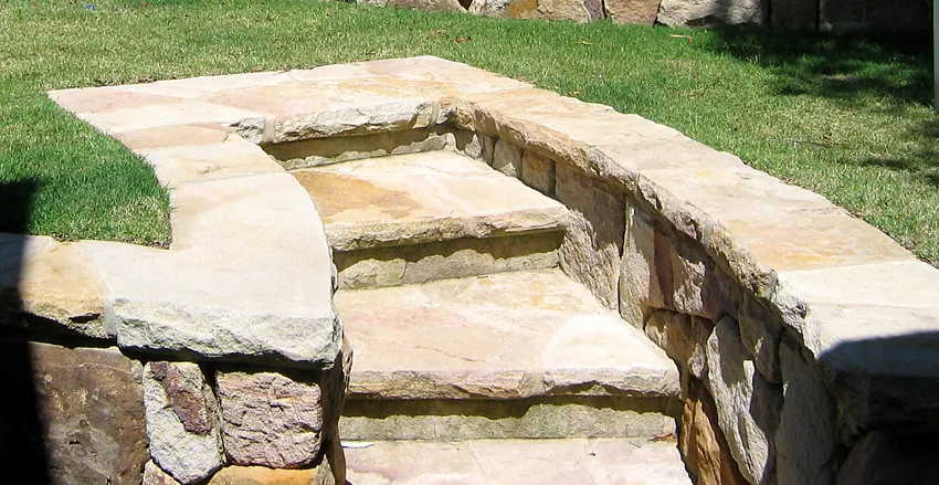 Natural stone steps set into a terraced garden